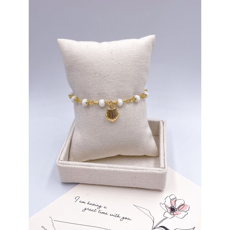PULSEIRA FOLHEADA A OURO - CRISTAIS BRANCO COM PINGENTE CONCHA
