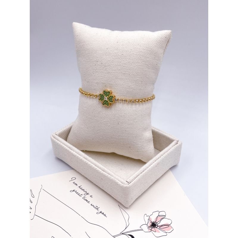 PULSEIRA FOLHEADA A OURO - RIVIERA CRISTAL COM PINGENTE CRAVEJADO TREVO